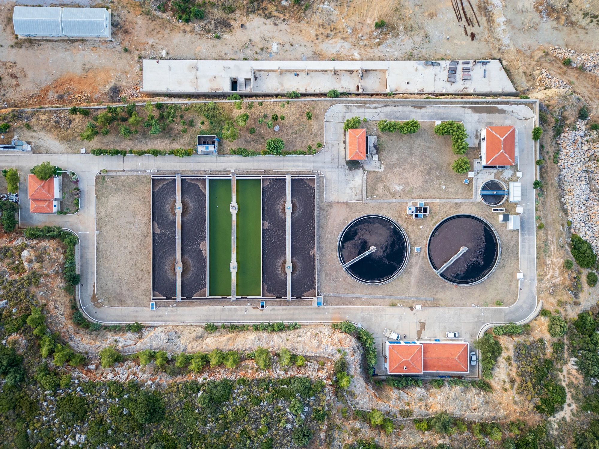 Aerial view of wastewater treatment plant with sedimentation tanks