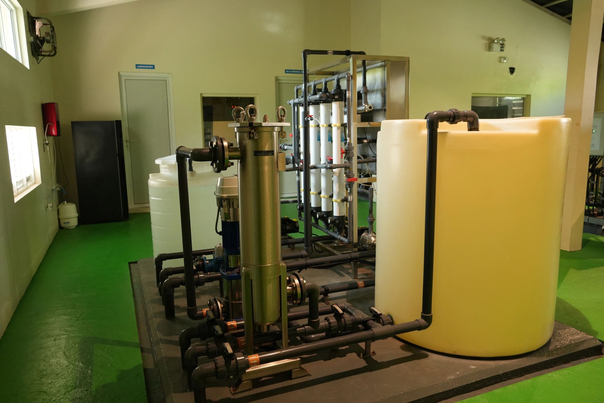 Industrial water processing system with tanks and filtration units